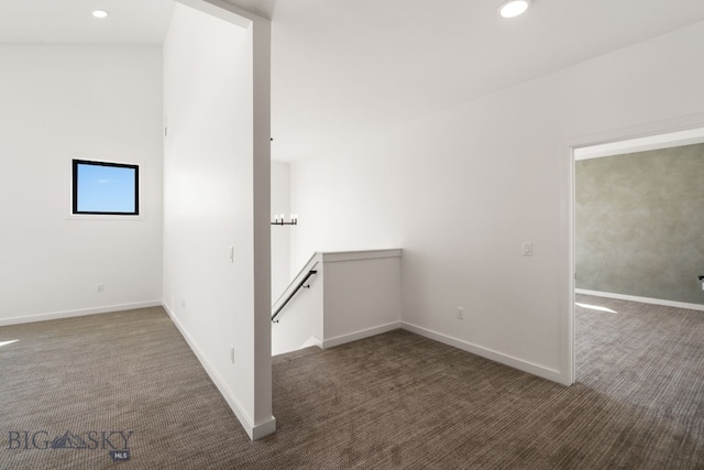 carpeted empty room featuring recessed lighting and baseboards