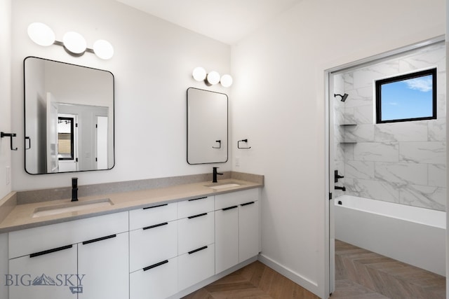 full bathroom featuring baseboards, a sink, and a healthy amount of sunlight