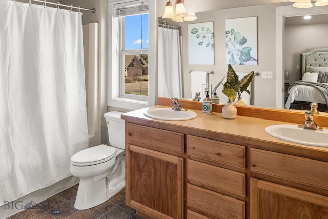 126 Pathfinder Trl, Bozeman, MT 59718 - full bath featuring toilet, ensuite bathroom, double vanity, and a shower with curtain