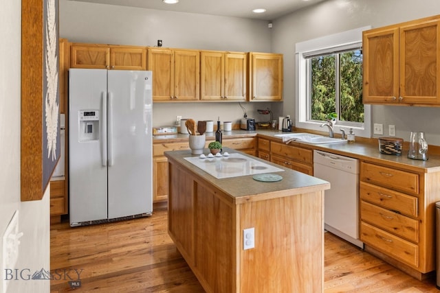 126 Pathfinder Trl, Bozeman, MT 59718 - kitchen featuring white appliances, a sink, light wood-style flooring, a kitchen island, and recessed lighting