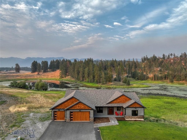 birds eye view of property with a forest view