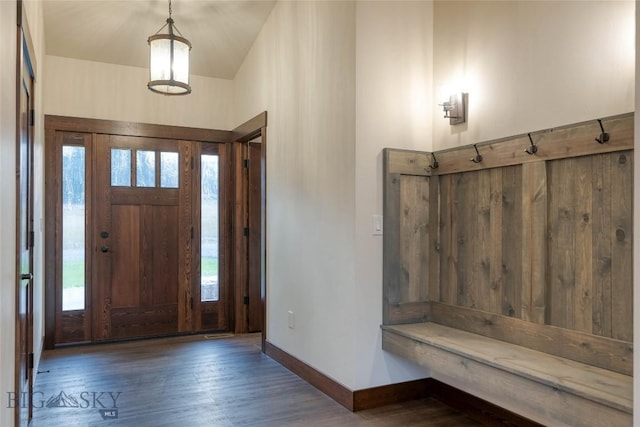 entrance foyer featuring baseboards and wood finished floors