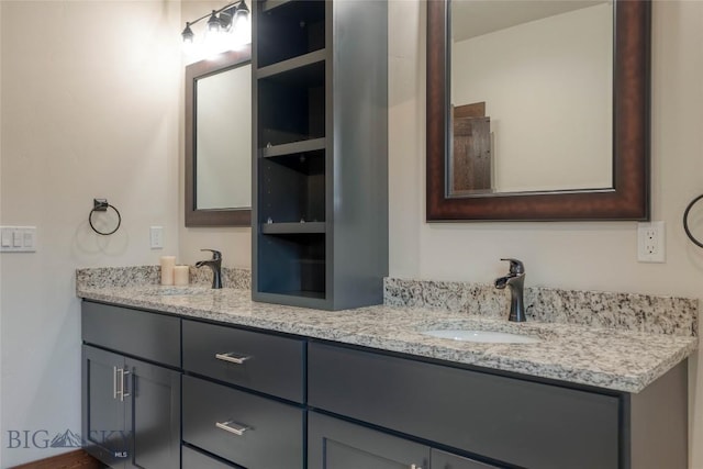 bathroom with a sink and double vanity