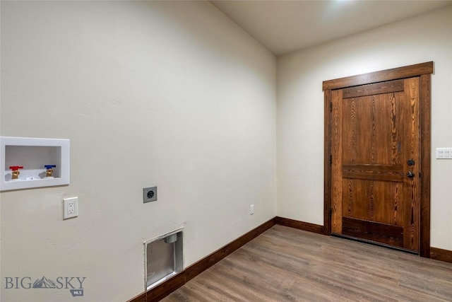 laundry room with hookup for a washing machine, wood finished floors, electric dryer hookup, baseboards, and laundry area