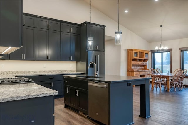 kitchen featuring dark wood-style floors, an inviting chandelier, a sink, appliances with stainless steel finishes, and high vaulted ceiling
