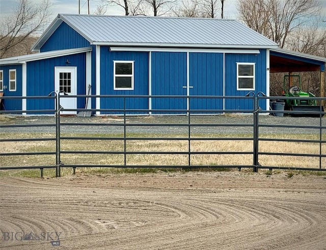 657 Waterloo Rd, Whitehall, MT 59759 - view of property exterior featuring an exterior structure, metal roof, and an outbuilding