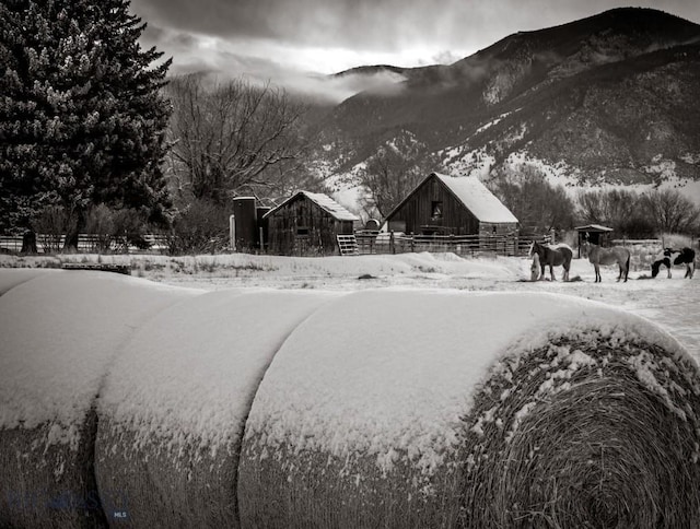657 Waterloo Rd, Whitehall, MT 59759 - view of community featuring a barn, a mountain view, and an outdoor structure