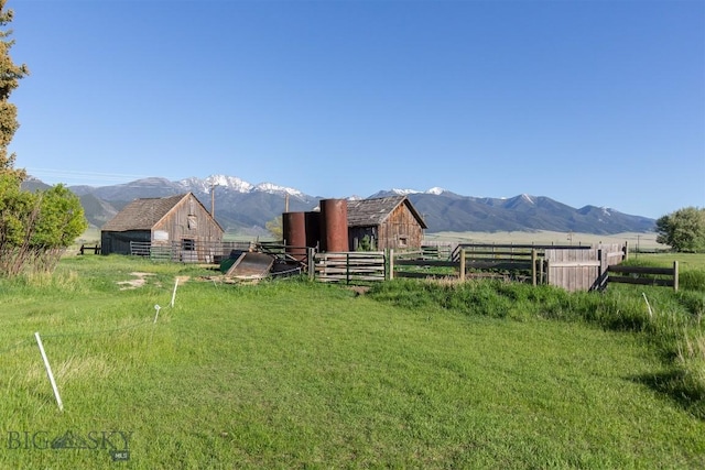 657 Waterloo Rd, Whitehall, MT 59759 - view of yard with a mountain view, a rural view, an outdoor structure, and a barn