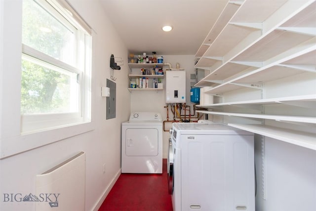 657 Waterloo Rd, Whitehall, MT 59759 - laundry room featuring washer and dryer, water heater, baseboards, electric panel, and recessed lighting