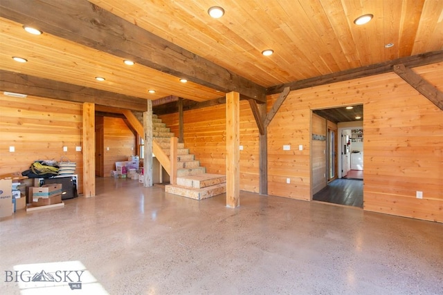 657 Waterloo Rd, Whitehall, MT 59759 - unfurnished living room featuring wood walls, recessed lighting, speckle patterned floor, stairs, and wood ceiling