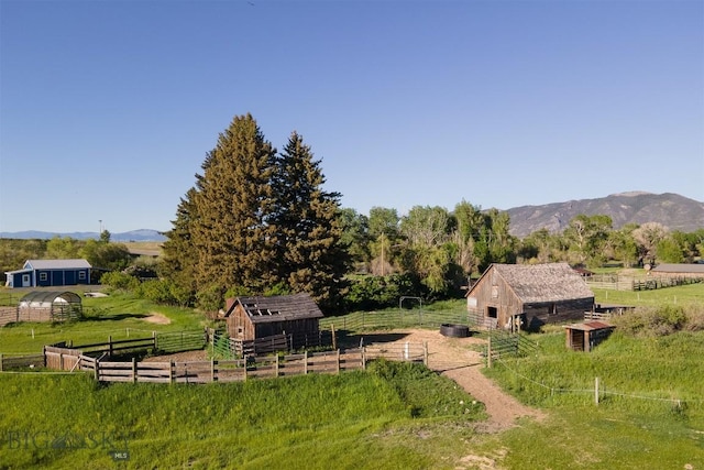 657 Waterloo Rd, Whitehall, MT 59759 - view of yard featuring an outbuilding, a view of rural / pastoral area, a mountain view, and an exterior structure