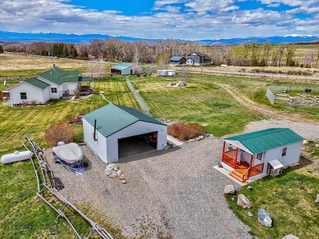 drone / aerial view featuring a rural view and a mountain view