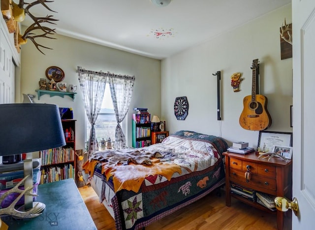 bedroom featuring wood finished floors