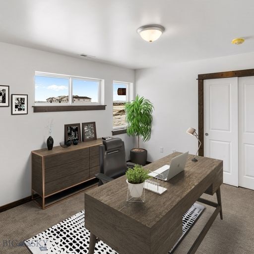 office area featuring dark carpet and baseboards