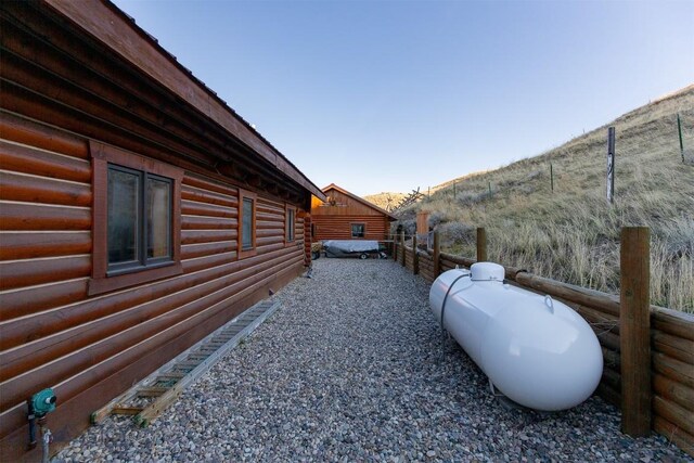 view of home's exterior featuring fence
