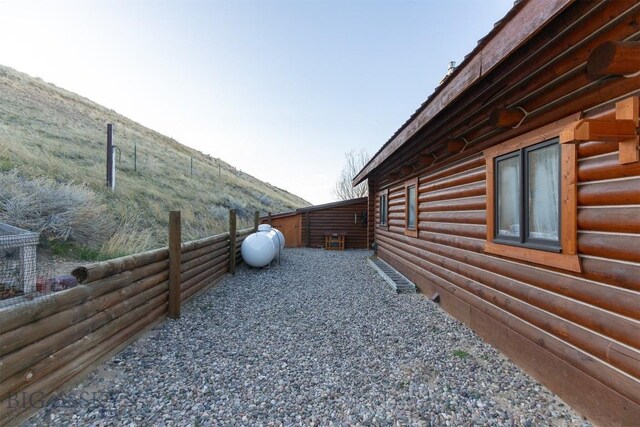 view of property exterior with a mountain view