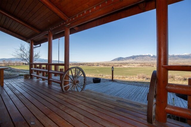 wooden terrace with a mountain view and a rural view