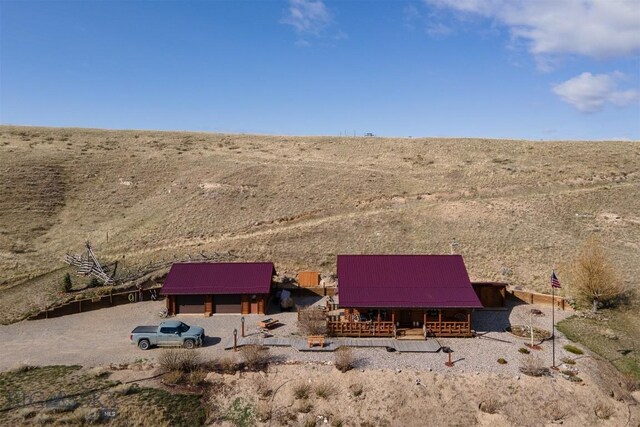 exterior space featuring a rural view and a desert view