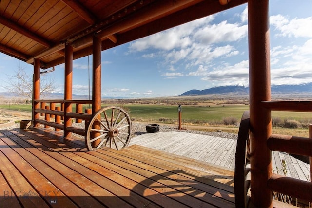 deck with a mountain view and a rural view