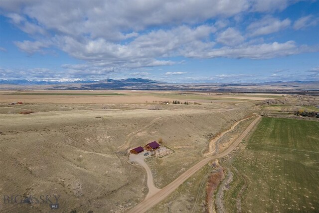 bird's eye view featuring a rural view and a mountain view