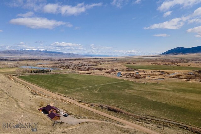 birds eye view of property featuring a rural view and a mountain view
