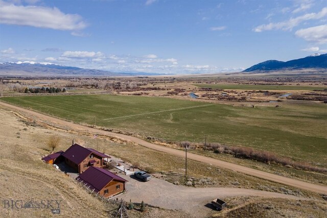 birds eye view of property featuring a mountain view and a rural view