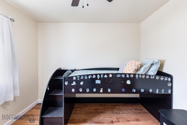 250 Jackson Ln, Belgrade, MT 59714 - bedroom featuring wood finished floors, a ceiling fan, and baseboards