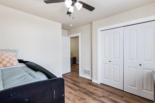 250 Jackson Ln, Belgrade, MT 59714 - bedroom featuring wood finished floors, a closet, baseboards, and ceiling fan