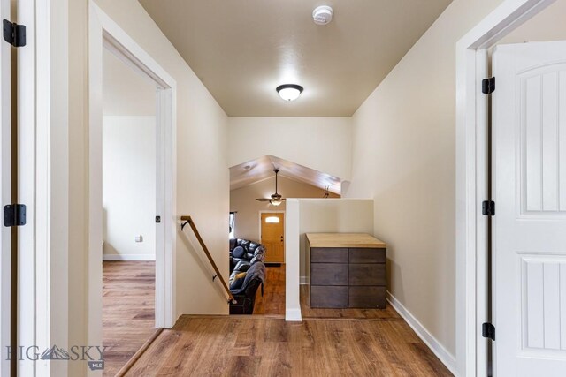 250 Jackson Ln, Belgrade, MT 59714 - hallway with wood finished floors, an upstairs landing, and baseboards