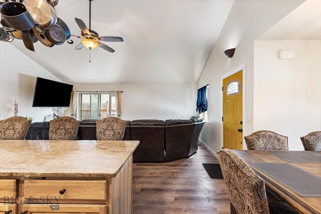 250 Jackson Ln, Belgrade, MT 59714 - living area with vaulted ceiling, dark wood finished floors, a ceiling fan, and baseboards