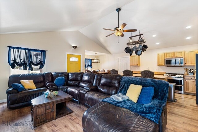 250 Jackson Ln, Belgrade, MT 59714 - living room featuring lofted ceiling, light wood finished floors, a ceiling fan, and recessed lighting