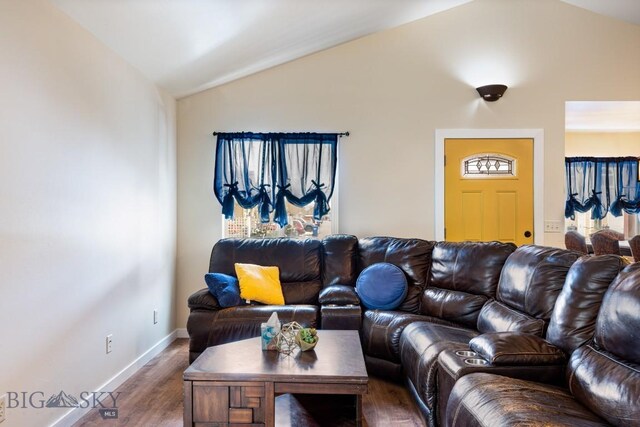 250 Jackson Ln, Belgrade, MT 59714 - living room featuring lofted ceiling, wood finished floors, and baseboards