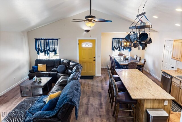 250 Jackson Ln, Belgrade, MT 59714 - living room featuring dark wood-style flooring, a ceiling fan, vaulted ceiling, and baseboards