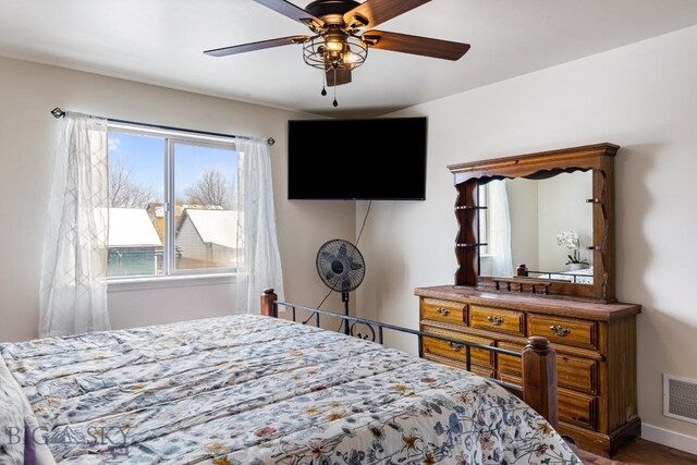 250 Jackson Ln, Belgrade, MT 59714 - bedroom featuring ceiling fan and wood finished floors