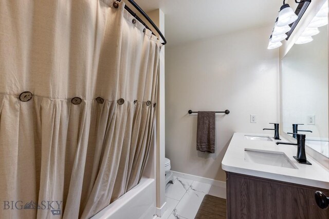 250 Jackson Ln, Belgrade, MT 59714 - full bathroom featuring marble look tiles, double vanity, shower / bath combo, baseboards, and toilet