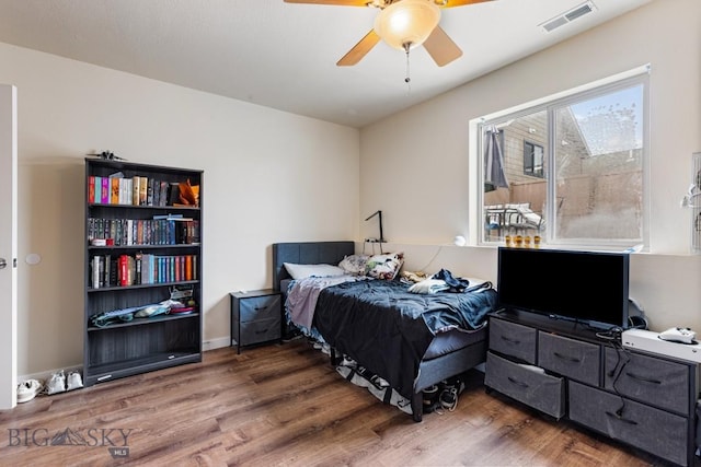 250 Jackson Ln, Belgrade, MT 59714 - bedroom featuring wood finished floors and a ceiling fan