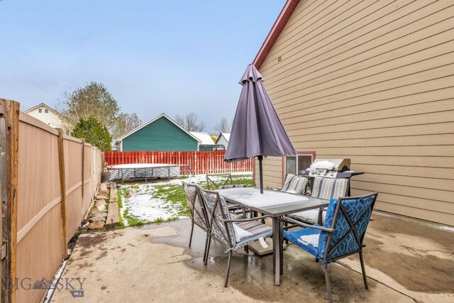 250 Jackson Ln, Belgrade, MT 59714 - fenced backyard featuring outdoor dining area and a patio