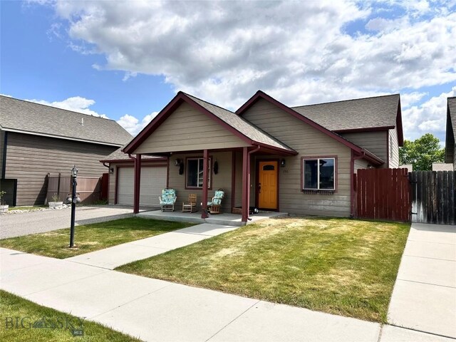 250 Jackson Ln, Belgrade, MT 59714 - view of front of property featuring a garage, driveway, covered porch, and a shingled roof