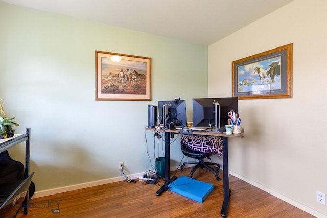 office area featuring baseboards and wood finished floors