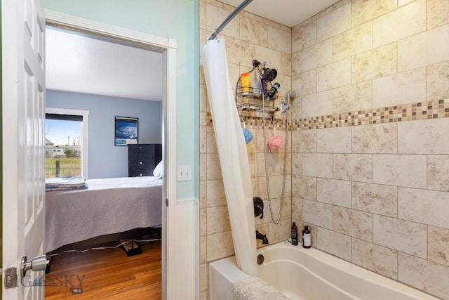 full bathroom featuring wood finished floors, ensuite bathroom, and shower / tub combo with curtain