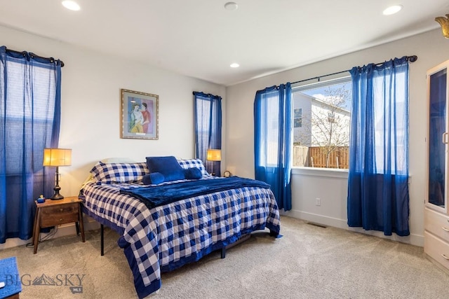 carpeted bedroom featuring recessed lighting, baseboards, and visible vents