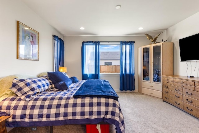 bedroom featuring light colored carpet and recessed lighting