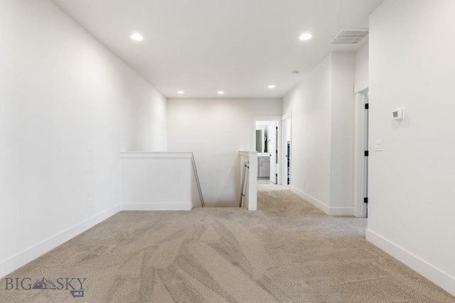 carpeted empty room with recessed lighting, baseboards, and visible vents