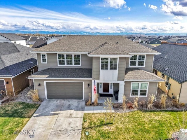 1508 Deadwood Loop, Belgrade, MT 59714 - view of front facade with concrete driveway, a garage, a residential view, a front yard, and roof with shingles