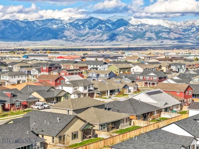 birds eye view of property with a mountain view and a residential view