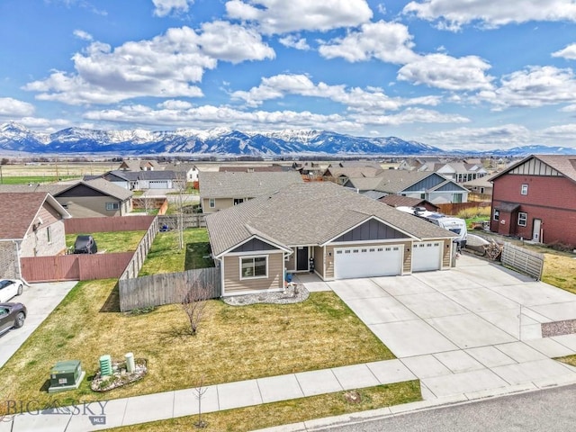 1708 Drummond Blvd, Belgrade, MT 59714 - view of front of property featuring board and batten siding, a garage, a residential view, and a mountain view