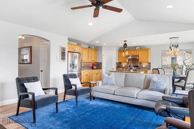 1708 Drummond Blvd, Belgrade, MT 59714 - living area with arched walkways, a ceiling fan, vaulted ceiling, recessed lighting, and baseboards