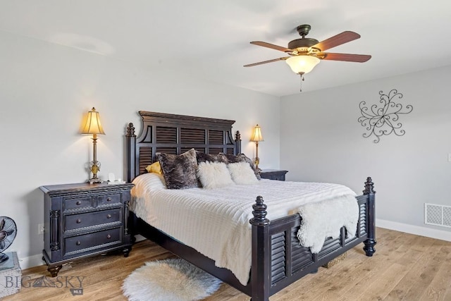 1708 Drummond Blvd, Belgrade, MT 59714 - bedroom with wood finished floors, baseboards, and a ceiling fan