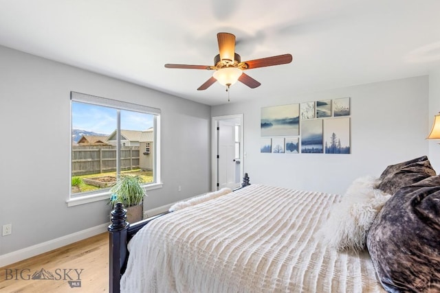 1708 Drummond Blvd, Belgrade, MT 59714 - bedroom with wood finished floors, baseboards, and a ceiling fan