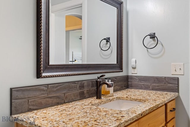 1708 Drummond Blvd, Belgrade, MT 59714 - bathroom featuring vanity and decorative backsplash